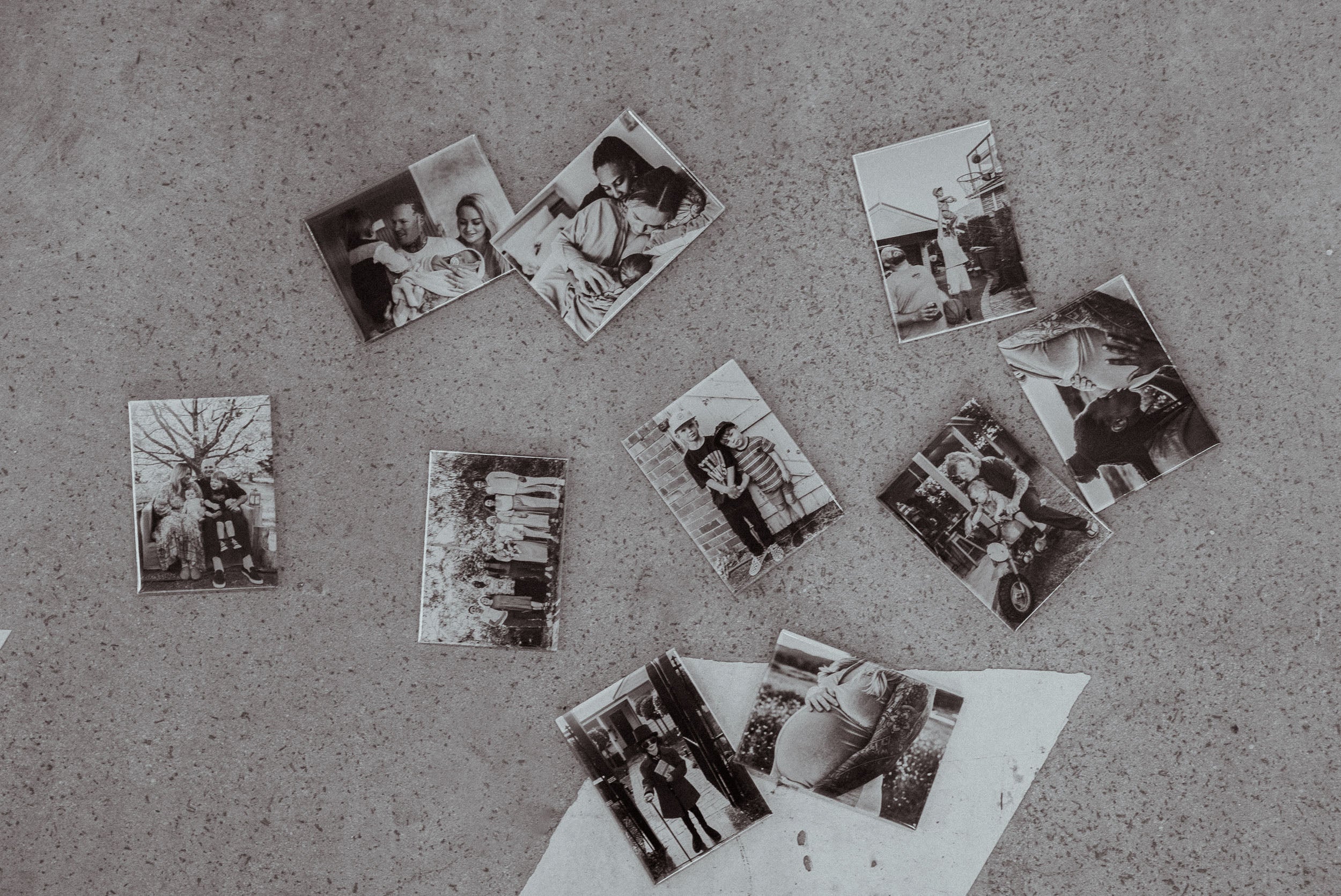 Various magnets with custom prints, spread out and on display in black and white.