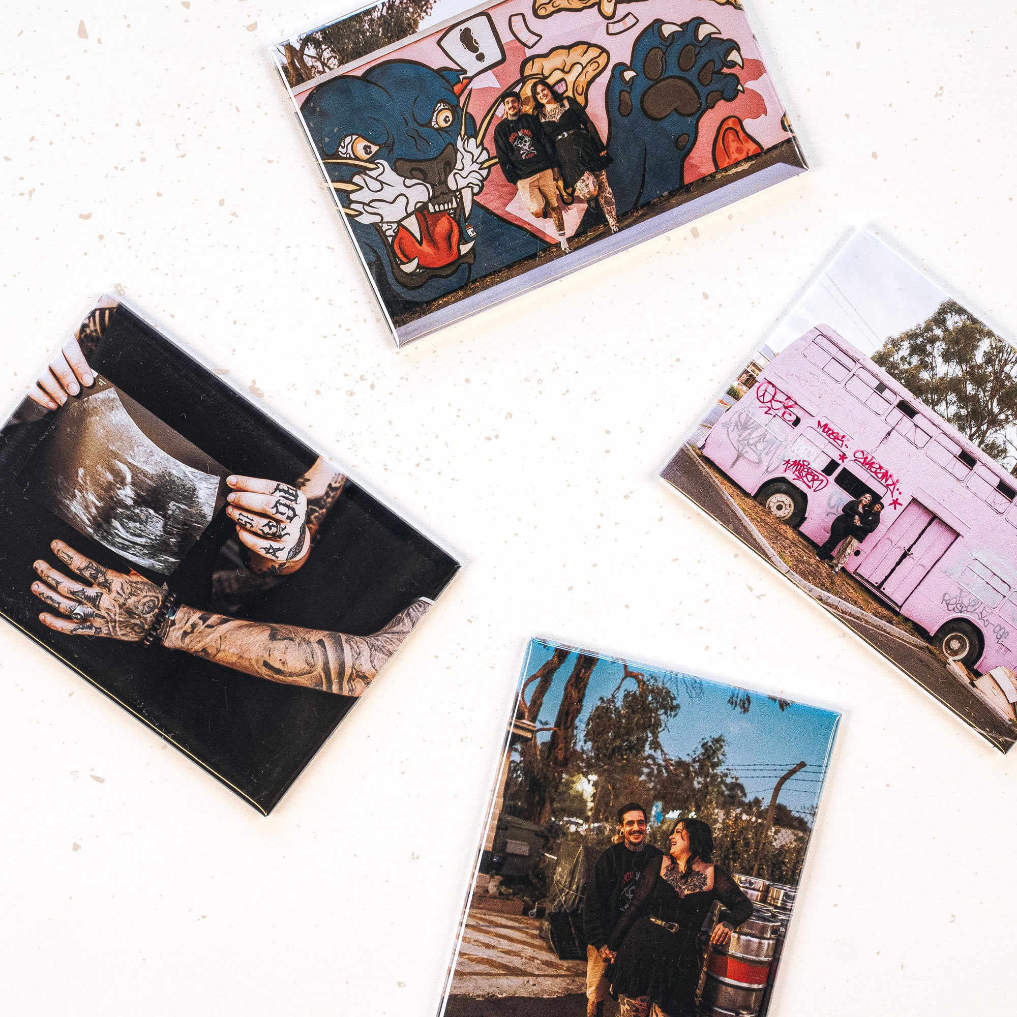 Four different magnets displayed on a white background, all printed with happy family photos.